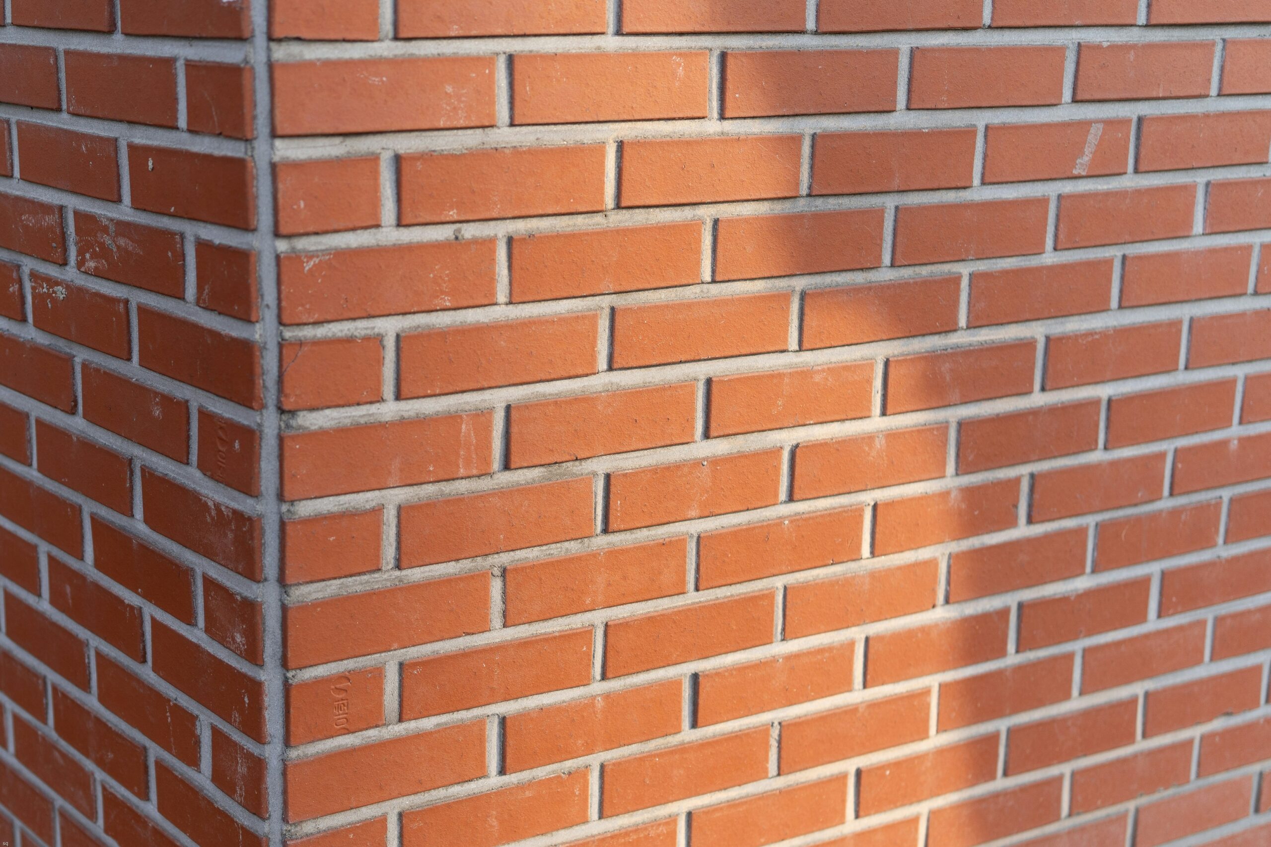 Structural thermal blockwork being laid for internal partition walls, highlighting energy-efficient building materials and solid construction.