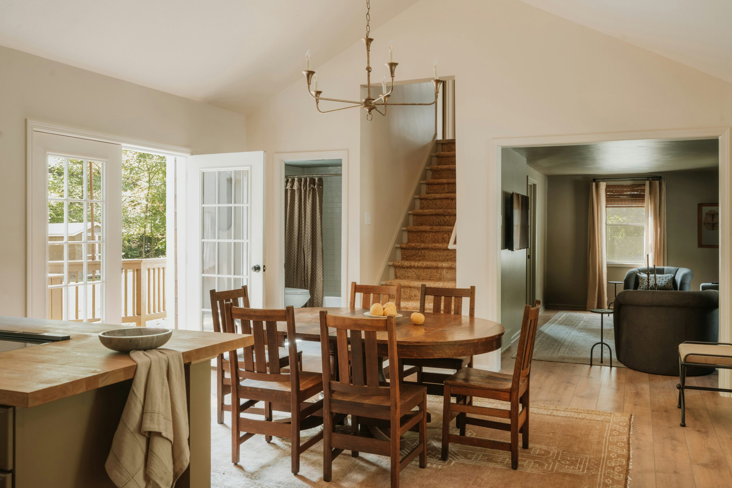 View of a structural wall removal to create a seamless open-plan living and dining area, demonstrating expert renovation and space reconfiguration.